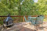 Furnished deck with covered firepit